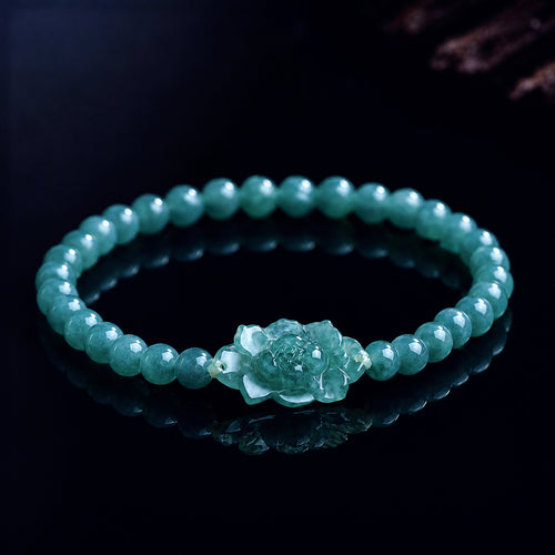Blue green jade lotus bracelet worn by woman
