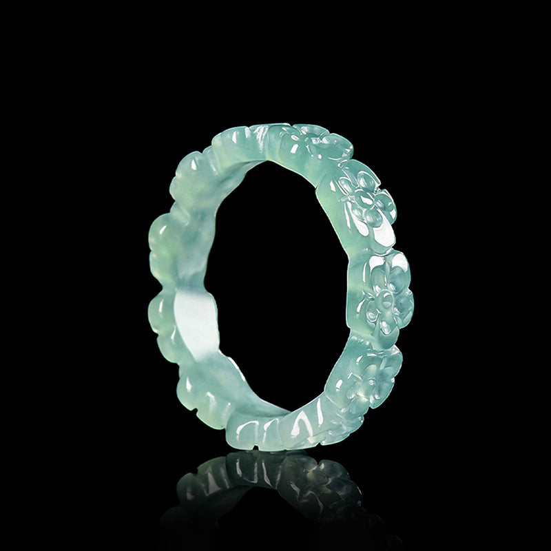 Pale green jadeite peach blossom ring worn by woman
