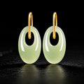 Natural light green jadeite oval drop earrings
