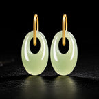 Natural light green jadeite oval drop earrings