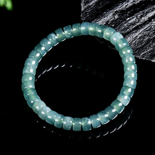 Blue green jade abacus bead bracelet worn on wrist