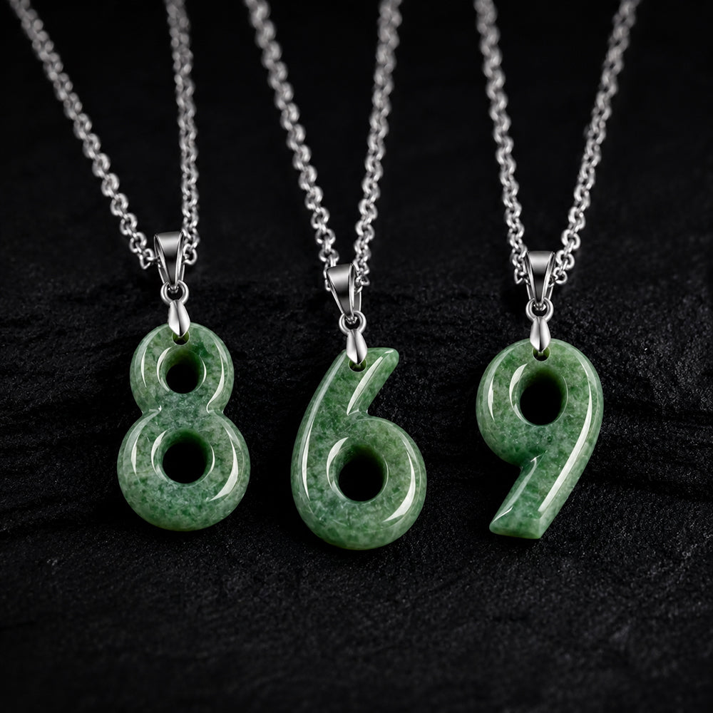 Green jade number pendants 8 6 and 9 on black background